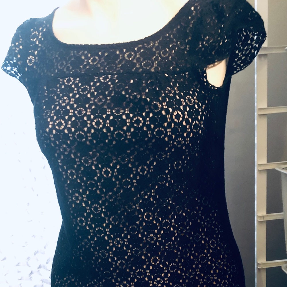 Dessignet Black lace dress with lining.